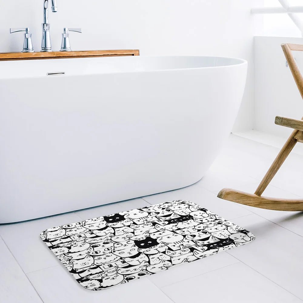 Black and White Animated Cats with Differing Expressions Kitchen Mat