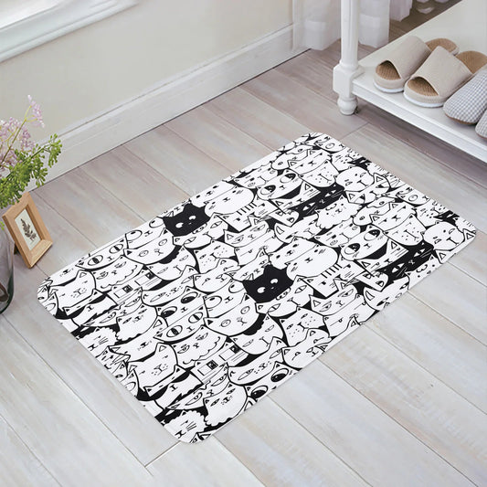 Black and White Animated Cats with Differing Expressions Kitchen Mat